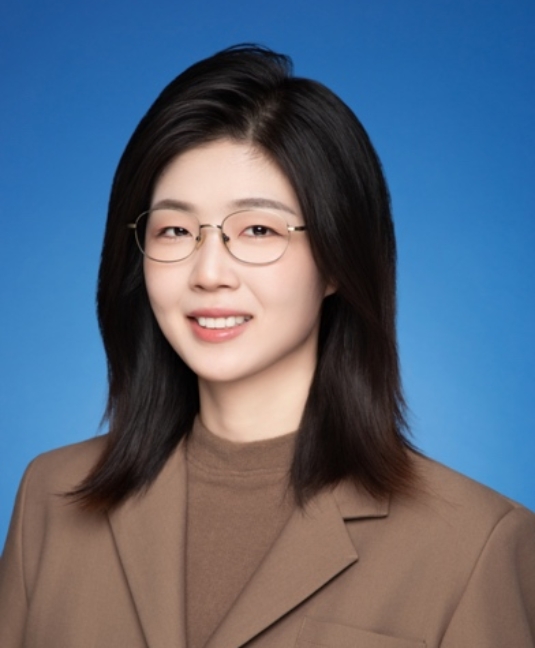 A person wearing glasses and a brown jacketAI-generated content may be incorrect.